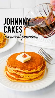 a stack of cornmeal pancakes with syrup being drizzled on top