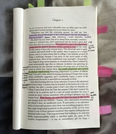 an open book with writing on it and colored sticky notes attached to the page,