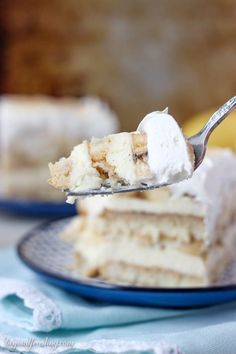 a piece of cake on a plate with a fork in it and the rest of the cake is half eaten