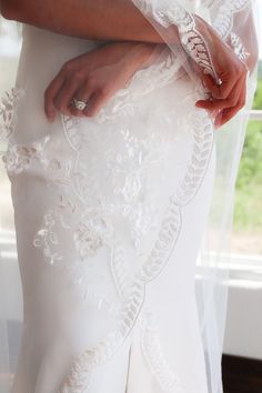 a close up of a person wearing a wedding dress