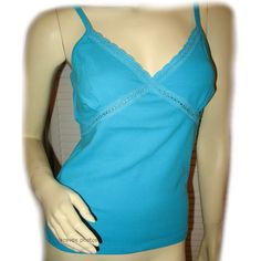 New, Never Used/Washed, Womens Blue Sleeveless V-Neck Spaghetti Top Tank Cami Camisole Blouse. Adjustable Spaghetti Strap. Nice Lace Criss Cross Trim Detail V Neckline. 100% Cotton. Available In Sizes Small (S), Medium (M), Large (L), While Supply Last. Womens Tops As Casual Wear, Summer Tops, Sun/Beach Wear, Everyday Wear Clothes/Clothing. We Sell More Clothes, Check Out Our Closet, Use Bundle To Save/Combine Shipping. Seller Code: Pre12-Bx03 Blue V-neck Tank Top With Built-in Bra, Blue Stretch Camisole With Built-in Bra, Blue Spaghetti Strap Vest Top, Blue Camisole With Built-in Bra And Tank Straps, Stretch V-neck Camisole For Summer, Summer V-neck Stretch Camisole, Blue Stretch Cami Tank Top, Blue Sleeveless Camisole With Built-in Bra, Spring Blue Camisole With Built-in Bra