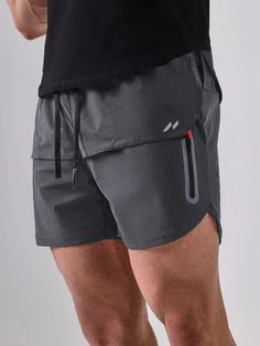 We created these shorts with your comfort in mind. Moisture-wicking and breathable fabrics keep you cool during any activity. The innovative design includes an adjustable waistband and strategically placed pockets for easy access to your essentials. We understand your active lifestyle and designed these shorts to enhance every moment.
 Make an athletic statement in these sleek 5 inch men's gym running workout shorts. The 4-way stretch fabric provides muscle support and accelerates reco Functional Athletic Shorts With Built-in Liner, Sportswear Athletic Shorts With 4-way Stretch And Pockets, Athletic Shorts With Pockets And 4-way Stretch, Functional Breathable Short Bottoms, 4-way Stretch Sportswear Athletic Shorts With Pockets, Functional Short Swim Trunks With Built-in Shorts, Casual Training Shorts With Pockets, Sports Athleisure Shorts With Functional Pockets, Athleisure Athletic Shorts With Functional Pockets For Gym