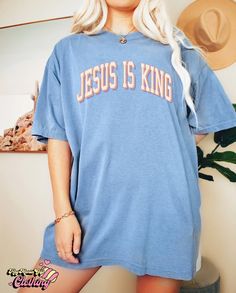 Product details: ✔️ NAME: Jesus Is King T-Shirt, Jesus Shirt, Christian Shirt, Faith Based Shirt, Bible Verse Shirt, Love Like Jesus Shirt, Worship Shirt, Faith Shirt ✔️ IMPORTANT NOTE: Both Men and Women can we our shirts because this is unisex style t-shirts; Wash item inside out in cold water, do not bleach, do not dry clean, do not iron directly on the design. ✔️ MATERIAL: 5.3-ounce, 100% cotton (99/1 cotton/poly (Ash) & 90/10 cotton/poly (Sport Grey); Heavyweight classic unisex tee; Taped neck and shoulders; Tearaway label; Decoration type: Digital Print ✔️ OUR DESIGN PRODUCTS: Each One are designed and sold in limited quantities. The designs are created by our incredibly talented in house graphic art team who often hand draw and illustrate each Tee shirt design. ✔️ SIZE CHART: Please Blue Relaxed Fit Tops With Lettering, Blue Short Sleeve T-shirt With Lettering, Relaxed Fit Short Sleeve Shirt With Lettering, Blue Short Sleeve Tops With Lettering, Heavenly Fashion, Alabama T Shirts, Christian Crewneck, Jesus Clothes, Chosen Shirt