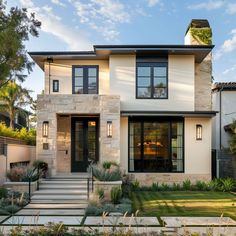 a modern home with stone and stucco exterior