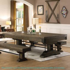 a dining room table with benches in front of it