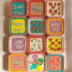 decorated cookies in the shape of squares with words and flowers on them that say good day