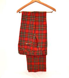 Vintage men's pants in excellent condition.  Created in the USA in the 1970's.  Red plaid, tartan, with two back pockets and flat front.  This is a fab pair of pants.    The person who had these didn't have hem or cuff put in.  You win, you can choose the length.  Extremely well-preserved wool pant. Label removed, ready to wear.  I consider unisex. Looks like waist has been altered. Measurements: 30 inch waist hips-38 inches Inseam-unhemmed Thanks-fresh inventory daily: https://www.etsy.com/shop 70s Plaid Pants, High Waisted Plaid Pants Men, 70s Mens Plaid Pants, Red Plaid Pants Pajamas, Plaid Pj Pants Mens, 30 Inch Waist, Unisex Looks, Men's Pants, Wool Pants