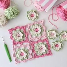 crochet flowers and yarn laid out on a table