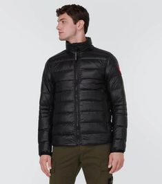 The Crofton jacket from Canada Goose is a versatile and lightweight design that packs into itself for easy portability. The design is finished with internal straps for backpack-like carrying..Material: 100% polyamide.Made in Canada.Closure: two-way zipped front.Lining: 100% polyamide.Filling: 90% down, 10% feathers.Pockets: zipped pockets.Care instructions: machine wash at 30 degrees.True to size.Straight fit.Non-stretchy fabric.Falls to the hip.The model in the picture is 185cm-6'1' and wearing Black Nylon Puffer Jacket For Travel, Black Casual Puffer Jacket For Travel, Casual Black Puffer Jacket For Travel, Versatile Nylon Long Sleeve Outerwear, Functional Outerwear With Zipper For Travel, Functional Travel Outerwear With Zipper Closure, Nylon Outerwear For Hiking In Fall, Packable Nylon Outerwear, Packable Functional Nylon Outerwear