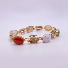 "A pre-loved 14k yellow gold \"bark\" style link Jade \"scarab\" bracelet with 5 oval jadeite multicolor stones and 1 black nephrite jade stone" Scarab Bracelet, Wedding Bracelets, Nephrite Jade, Jade Stone, Wedding Bracelet, Vintage Gifts, Minneapolis, Jade, Yellow Gold