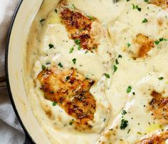 a skillet filled with chicken covered in gravy