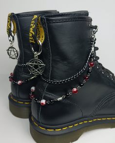 Boot chains with Onyx, Garnet and red splatter beads. Black chain. Choose full chain or half chain. Choose silvertone or black pentagram charms. If you have any questions, message me. Thank you! Rock Style Black Jewelry For Streetwear, Black Rock Style Jewelry For Streetwear, Pentagram Outfit, Diy Boot Chains, Punk Necklace With Adjustable Chain For Halloween, Halloween Emo Chain Jewelry, Boot Accessories Jewelry, Boots With Chains, Alec Core