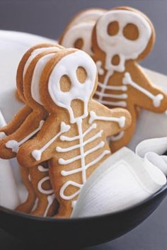 there are some skeleton cookies in the bowl