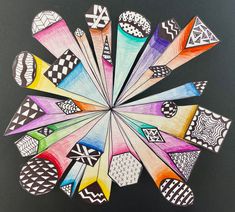 a drawing of many different colored objects in the shape of a flower on a black background