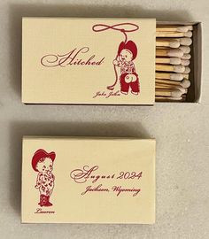 two matches are next to each other in a box with writing on the matchesticks