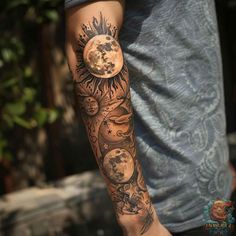 a man's arm with tattoos on it and the moon in the sky behind him