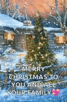 a christmas card with a snowy scene and a lit tree in front of a cabin