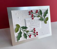 a christmas card with holly and berries on it