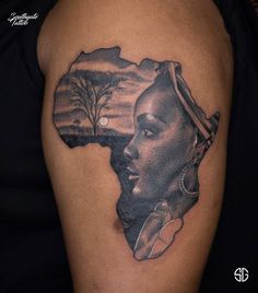 a woman's face with an african map tattoo on her arm and shoulder is shown