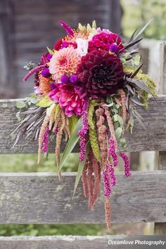 a bridal bouquet on a wooden bench