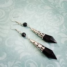 "These Victorian gothic style black or purple droplet earrings will add a touch of gothic glamour to your outfit, or just a touch of elegance if you're not a fan of the gothic look! They are made with pointed acrylic droplets encase in silverplated filigree wraps and then hung below glass beads on silverplated fittings. You can choose from earwires for pierced ears or clip ons for unpierced and they will be perfect for party season! In total they hang approx 3\" but are very lightweight and comf Vampire Outfit, Sci Fi Jewelry, Gothic Glamour, Outfit Female, Victorian Gothic Style, Vampire Clothes, Droplet Earrings, Gothic Looks, Daisy Necklace