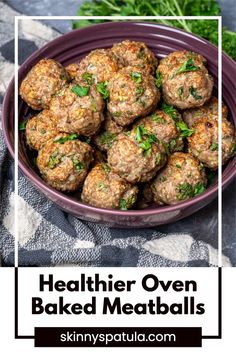 meatballs in a bowl with parsley on top and text overlay that reads healthier oven baked meatballs