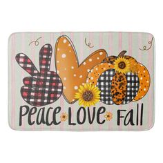 a door mat that says peace love fall with pumpkins and sunflowers on it