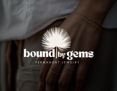 a woman's hand with two rings on it and the words bound by gems