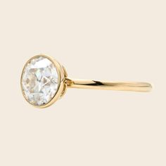 a gold ring with an oval cut diamond