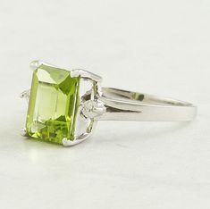 2.58 Carat Natural Green Peridot & Diamonds 14k Solid White Gold Ring * Classic-Style Ring * Emerald Cut Gemstone by JulLuxJewelry on Etsy Classic Green Gemstones With Accents, Green Peridot Birthstone Ring For Formal Occasions, Green Peridot Birthstone Ring For Formal Events, Formal Peridot Birthstone Ring For May, Formal Green Birthstone Ring With Diamond Accents, Classic Peridot Diamond Ring, Classic Peridot Gemstone Diamond Ring, Formal Peridot Diamond Ring With Center Stone, Fine Jewelry Peridot Gemstones For Formal Occasions