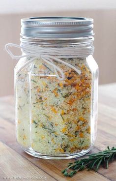 a jar filled with orange and thyme flavored salt