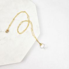 This special necklace features a stunning faceted quartz gemstone drop pendant. The sturdy, yet delicate 18k tarnish-resistant gold-plated satellite chain is 24" long and is dotted with tiny gold beads. Thanks to the beautiful variation of the natural stones, the color tone of the gemstone may vary slightly from the photo. Each crystal is perfectly unique! Elegant Drop Necklace With Faceted Beads For Gift, Gold Drop Crystal Necklace With Gemstone, Elegant Faceted Beads Drop Necklace For Gift, Gold Drop Crystal Necklace As Gift, Gold Drop Jewelry With Faceted Beads, Gold Drop Crystal Necklace For Gift, Gold Teardrop Crystal Necklace With Delicate Chain, Minimalist Gold Crystal Necklace With Faceted Beads, Dainty Gold Crystal Necklace With Faceted Beads