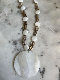 Beautiful abalone, stone and mother of pearl adjustable necklace. This vintage item is approximately 20 inches long and it's shortest. It could be made would be 16 3/8 of an inch the center is a shell. It's absolutely beautiful the center is 2 7/8 inches high by 2 7/8 inches, and very good vintage condition. Free shipping in the USA. Luxury Artisan Necklace With Mother Of Pearl, Adjustable Mother Of Pearl Necklace With Pearl Pendant, Adjustable Mother Of Pearl Necklace With Pendant, Shell-shaped Mother Of Pearl Necklace With Pearl Pendant, Shell Necklace With Pearl Pendant In Mother Of Pearl, Beaded Mother Of Pearl Round Necklaces, Elegant Adjustable Shell Necklace With Natural Stones, Elegant Adjustable Abalone Shell Necklace, Elegant Abalone Shell Necklace