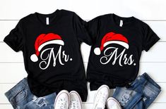 two shirts that say mr and mrs with santa hats on them, sitting next to each other