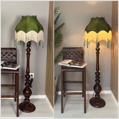 a lamp that is sitting on top of a wooden floor next to a table with a book