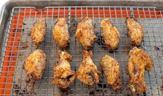 chicken wings cooking on a grill in an oven