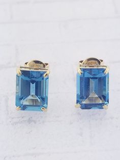 Blue Topaz stud earrings. Details: Weight: 2.3 grams Primary stone: Blue Topaz ( Appx. 2.50 tcw. ) Stone Shape: Emerald Cut Style: Studs Metal: 14k Yellow Gold Condition: Brand new PACKAGING: Each item comes in a jewelry box and wrapped beautifully as a gift. If you would like us to include a gift note in the parcel, please leave us a message with your order about the content of the note. We would love to prepare for you. CUSTOM ORDERS: We welcome all kinds of custom orders. Please reach out to Classic Blue Topaz Birthstone Earrings, Classic Blue Hallmarked Earrings, Classic Blue Topaz Gemstone Earrings, Classic Yellow Gold Blue Topaz Earrings, Classic Blue Topaz Yellow Gold Earrings, Blue Gemstone Earrings In 14k Gold, Yellow Gold Earrings, What Is Advertising, New Packaging