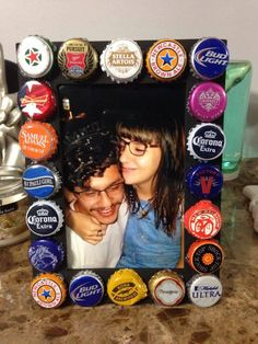 a photo frame made out of beer bottle caps