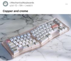 a computer keyboard sitting on top of a marble counter