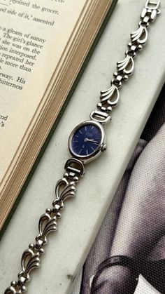 Elegant Blue Jewelry And Watches For Formal Occasions, Vintage Silver Stainless Steel Watches, Elegant Blue Stainless Steel Watch Accessories, Classic Metal Watch Accessories For Formal Occasions, Classic Metal Watch For Formal Occasions, Elegant Blue Watch Accessories With Metal Dial, Vintage Silver Watch Accessories With Polished Finish, Vintage Silver Stainless Steel Watch Accessories, Vintage Stainless Steel Watch With Bracelet Strap