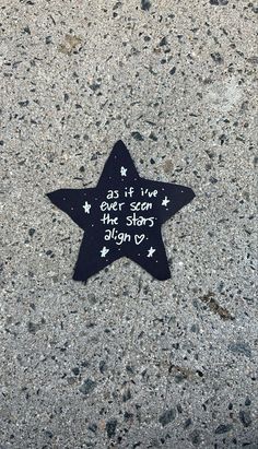 a black and white star with writing on it