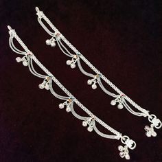 Beautiful Pair of anklets in silver. They have been adorned with small bells that make a beautiful noise. They are available in a few different sizes. Fits and sits like a curve on the ankles. Best for gifting or for personal use, wear it to any occasion and be the spotlight. Feel free to contact us at any time. We will try to promise you amazing shopping experience. Eye-catching and unique jewelry that will set you apart. Gift this piece to a loved one, and see their face light up with joy. Can Cotton Dress Indian, Sequence Blouse, Kurtis Tops, Saree Petticoat, Kurta Pajama Men, Silver Pooja Items, Full Sleeve Blouse, Saree Jewellery, Belt Blouse