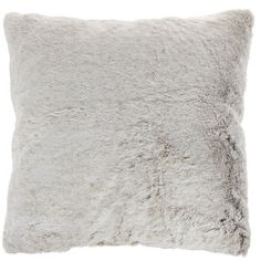 a white pillow with grey fur on it