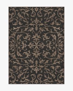 a black and brown rug with an intricate design