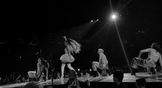 a group of people standing on top of a stage