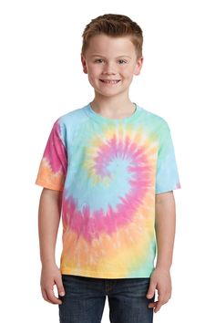 a young boy standing in front of a white background wearing a tie - dyed shirt