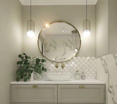 a bathroom with marble counter tops and white cabinets, along with a round mirror above the sink