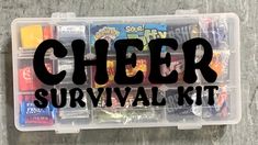 a clear box filled with lots of different types of food and the words cheer survival kit