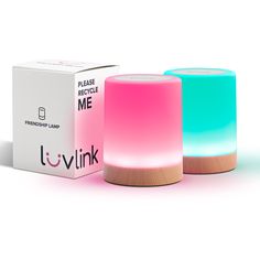 two different colored lights sitting next to each other in front of a box and packaging