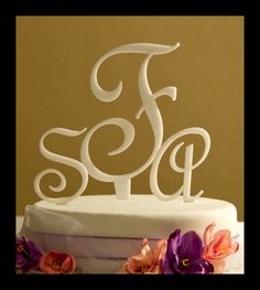 a white cake with the letter f on it